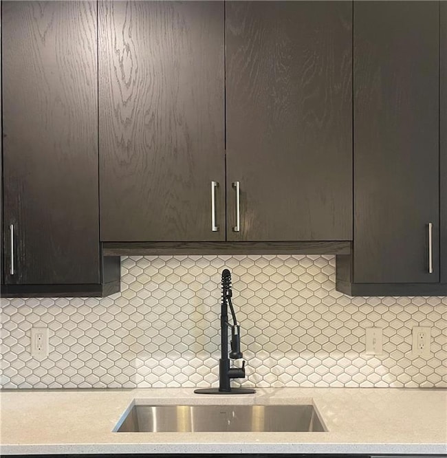 Detailed view of light countertops and dark brown
