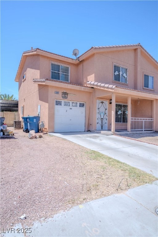 View of front of home featuring stucco siding, an