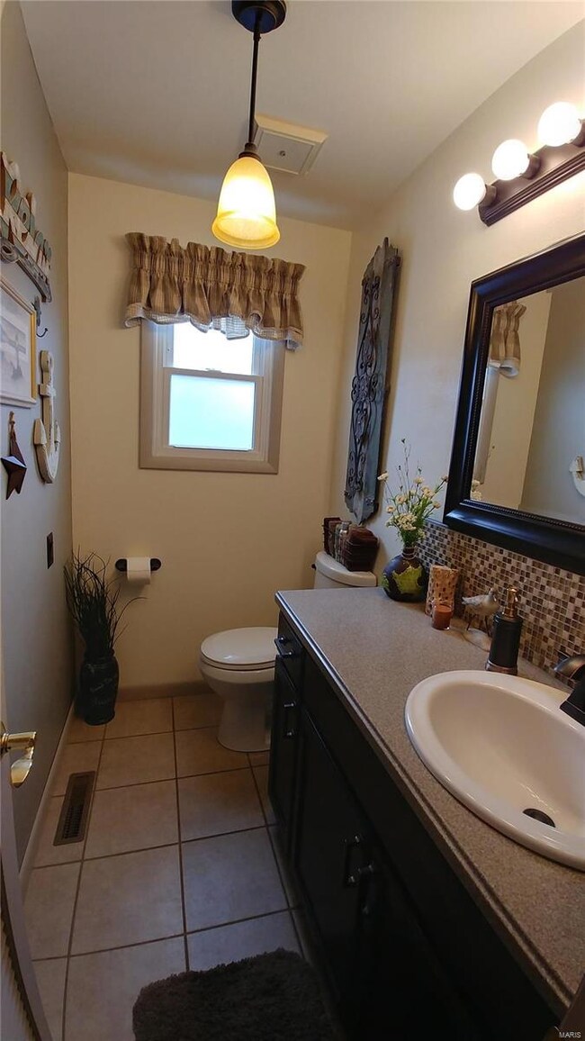 1/2 bath off garage/kitchen.