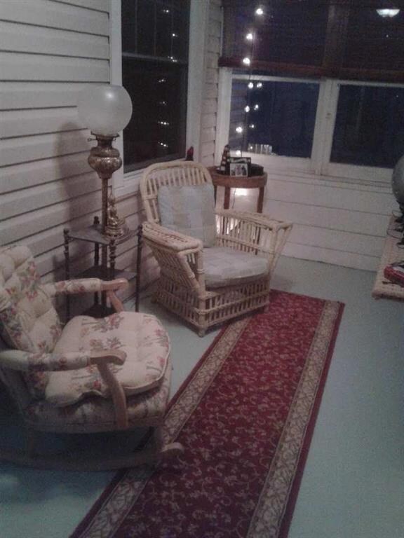 Enclosed front porch for your enjoyment.