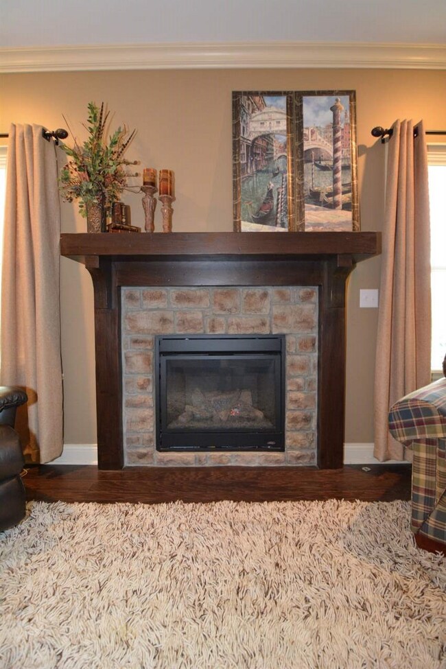 Gas fireplace with custom mantle.