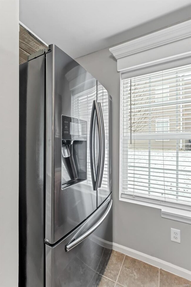 Graphite French door refrigerator with a water dis