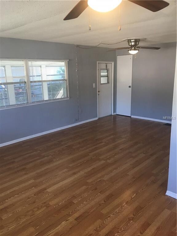 Living Room with Coat Closet and Door to Florida R