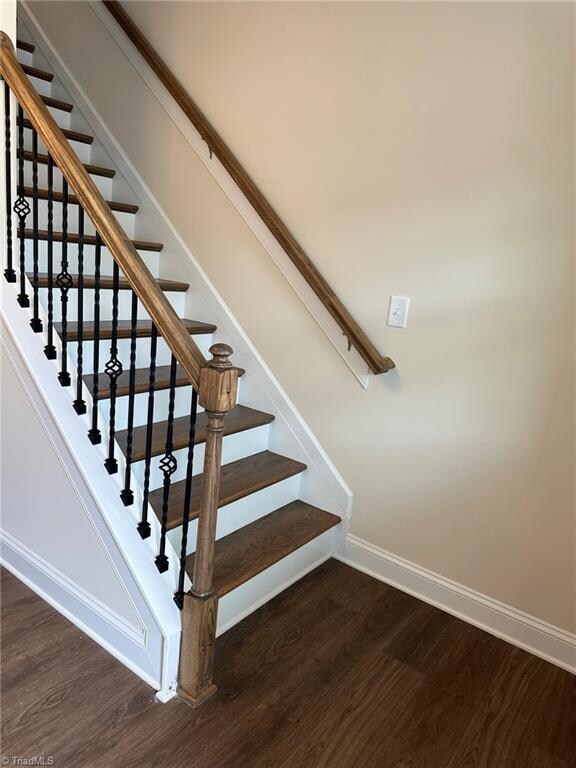 Beautiful wood stairs & iron pickets