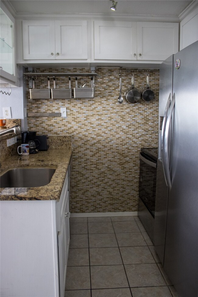 The kitchen is equipped with a brand-new stove, di