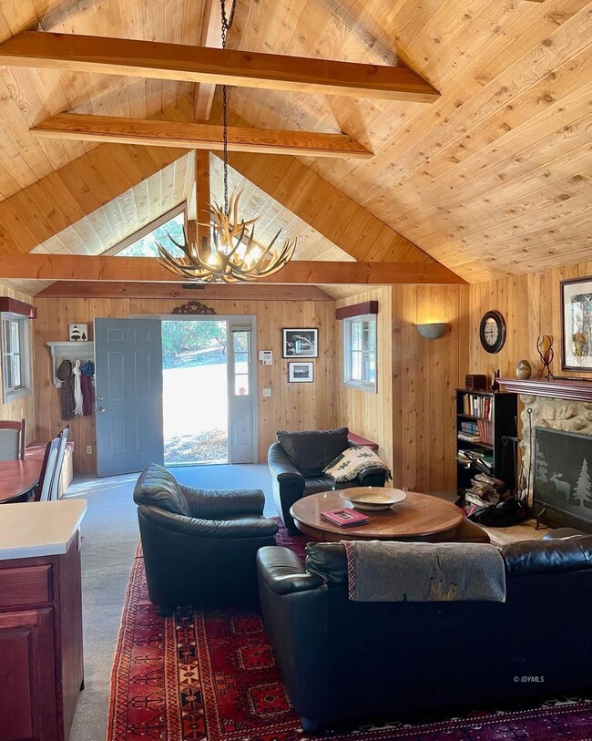 Open layout with beamed ceilings