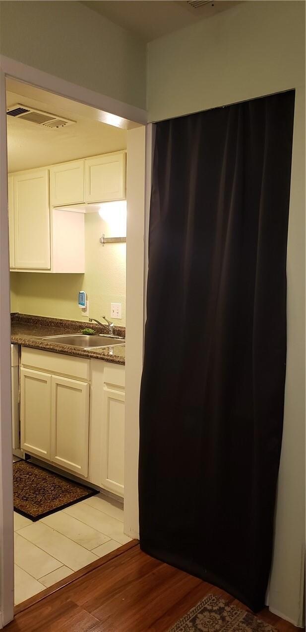 Curtained room with stackable washer and dryer included!