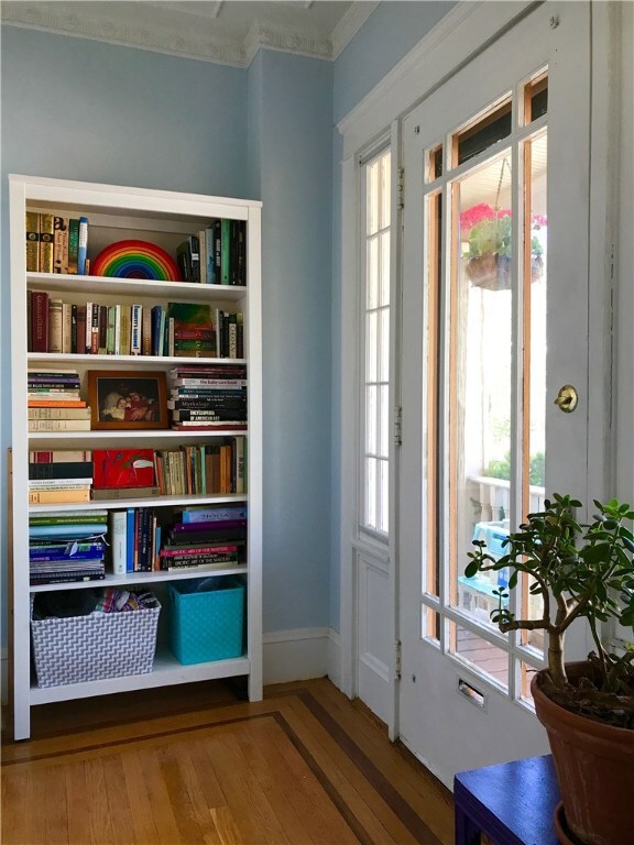 Hardwood Floors With A Cherry Inlay Greet You When