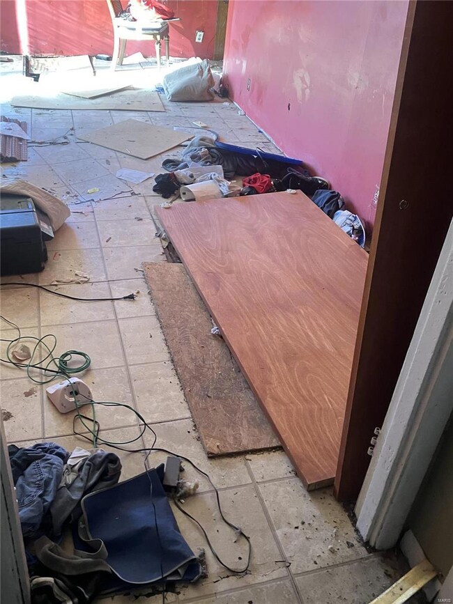 one of many holes in floor under wood