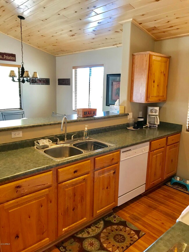 KITCHEN LOOKS OUT TO GREAT ROOM