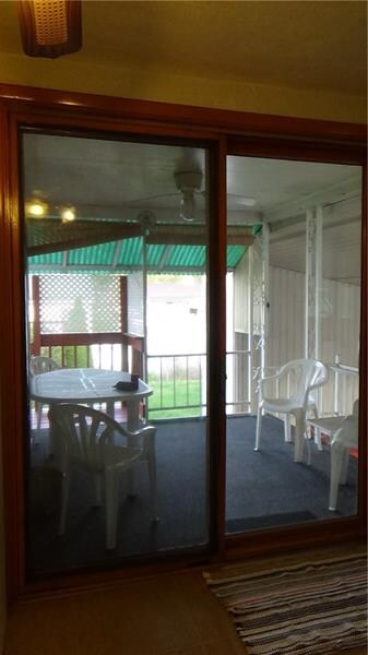 Exit kitchen to covered porch.