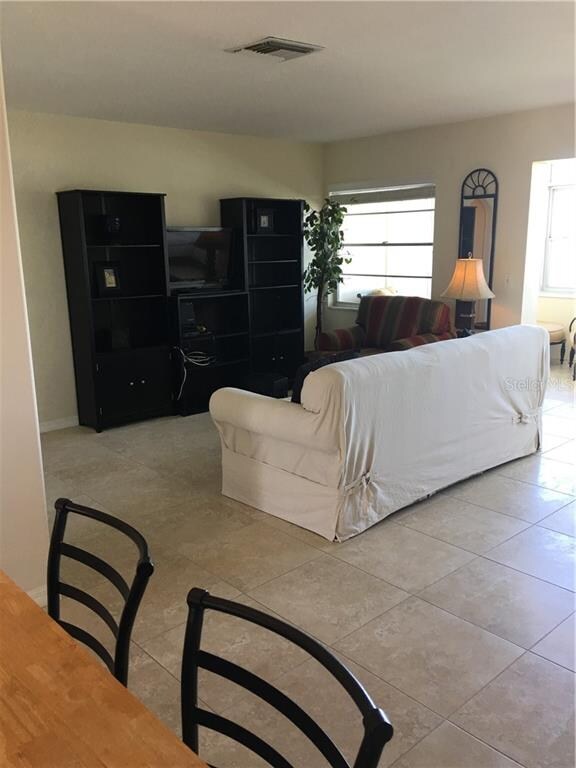 LARGE LIVING ROOM. CLOSET IS BEHIND THE ENTERTAINM