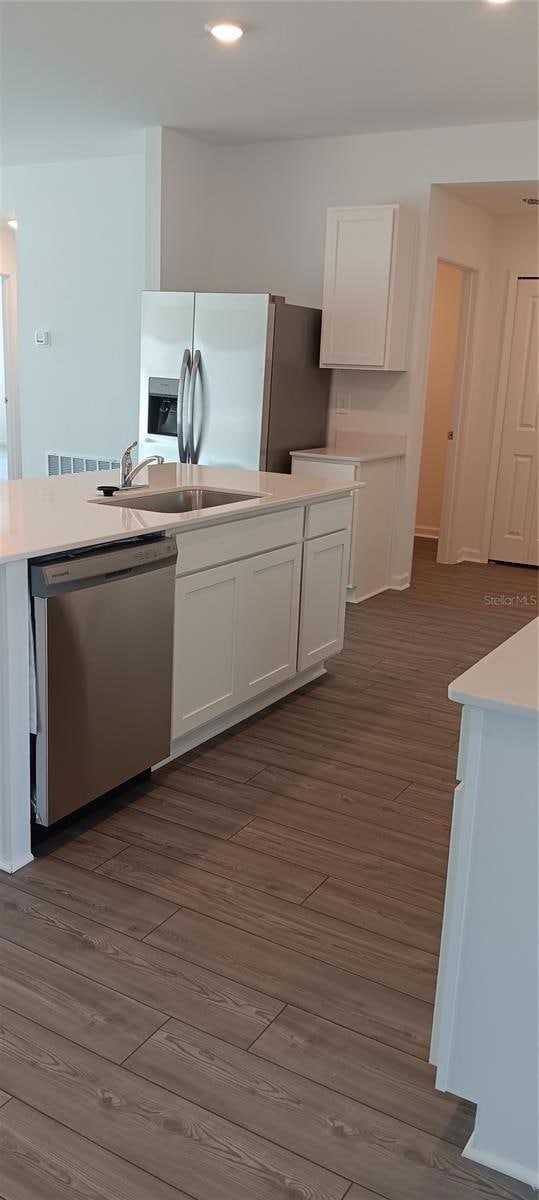 Kitchen with SS appliances and quartz countertops