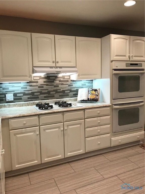Kitchen showing under cabinet lighting