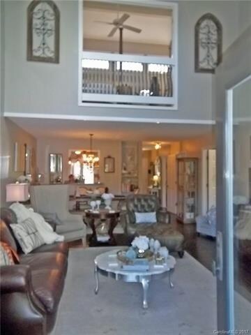 Living room has vaulted ceiling