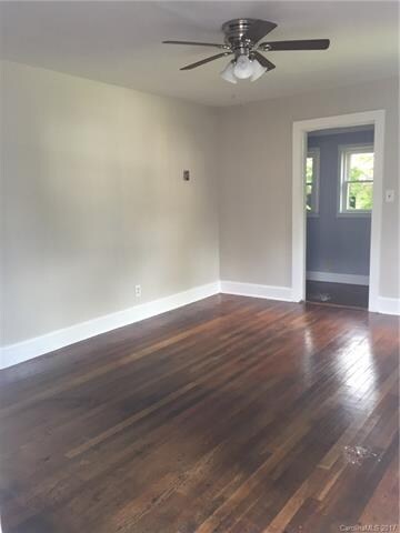 Family Room w/ refinished Hardwood floors, ceiling