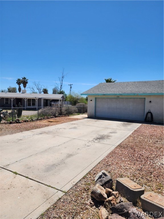 View of front facade featuring a garage