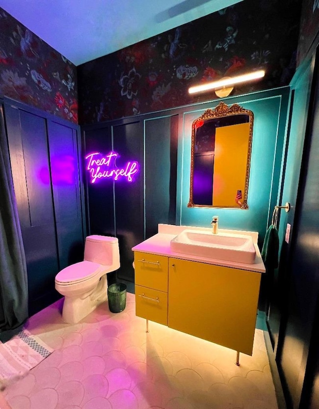Bathroom with vanity and toilet