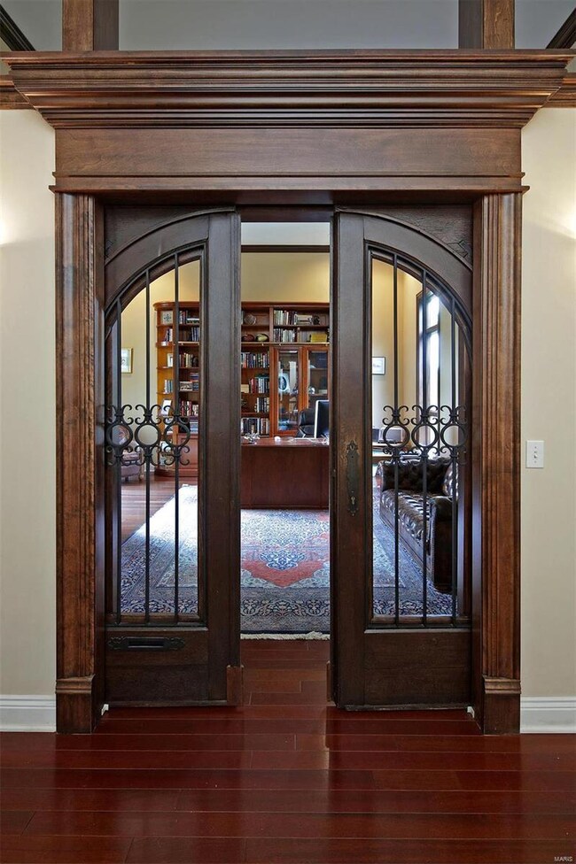 Antique Pocket doors in office are imported from France and add sophistication and character in addition to shutting out the sounds from the rest of the house