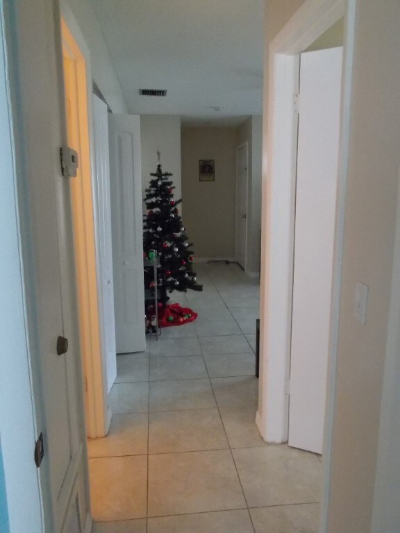 Hallway to bedrooms again notice the floors are ti