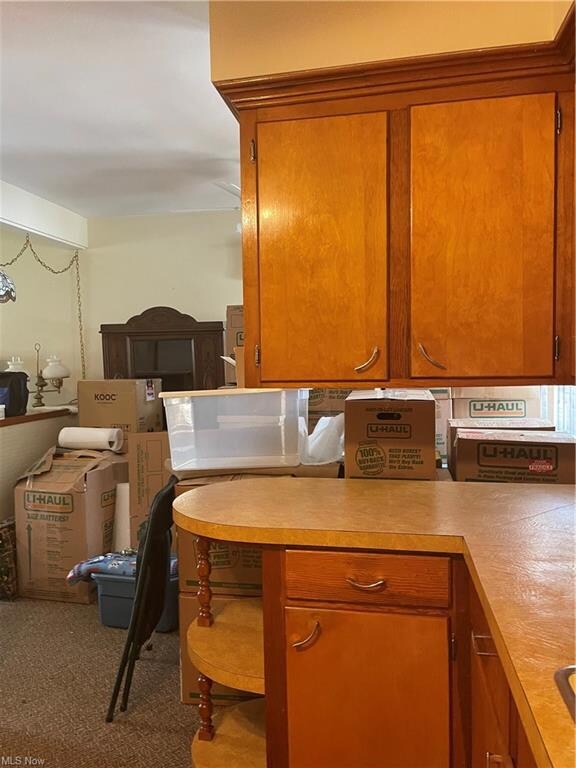 kitchen leads to dining area...excuse boxes...sell