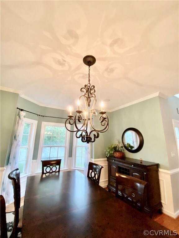 DINING ROOM WITH A LOVELY CHANDELIER