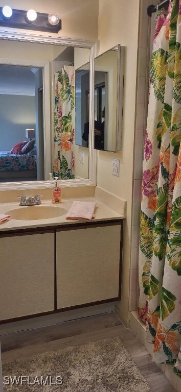 Bathroom featuring a shower with shower curtain an