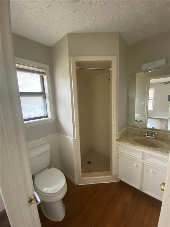 Full bathroom featuring wood finished floors, van