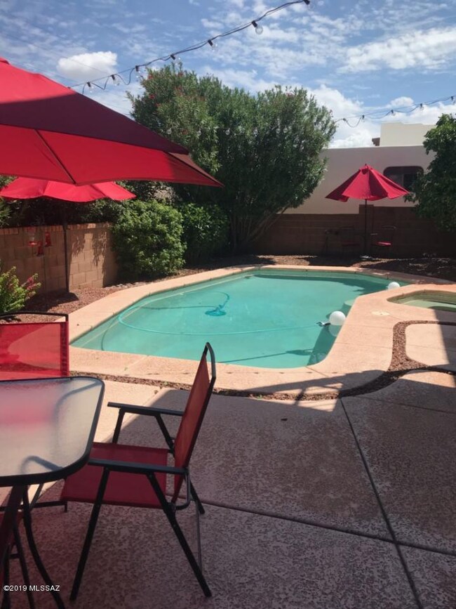 Pool with umbrellas & table