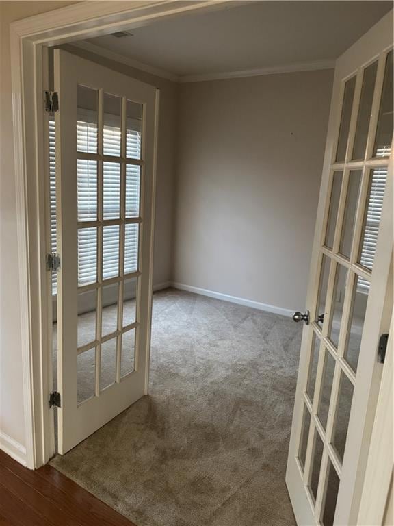 Empty room with french doors, baseboards, carpet f