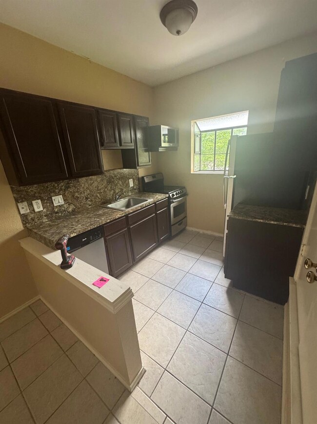 Kitchen featuring appliances with stainless steel