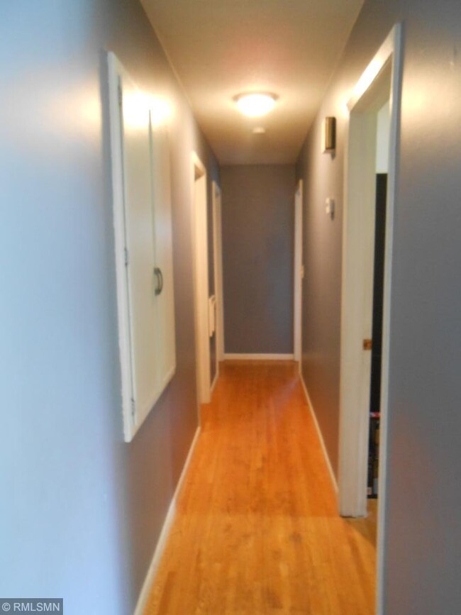 Hallway to 3 upper bedrooms and full bath