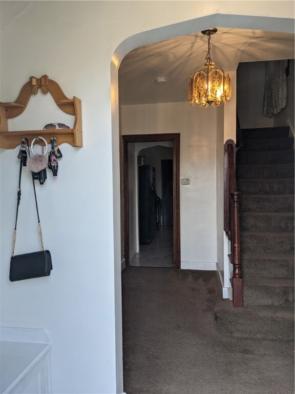 Entry way with coat closet and shoe cubby.  Check out the mail slot on the wall :)