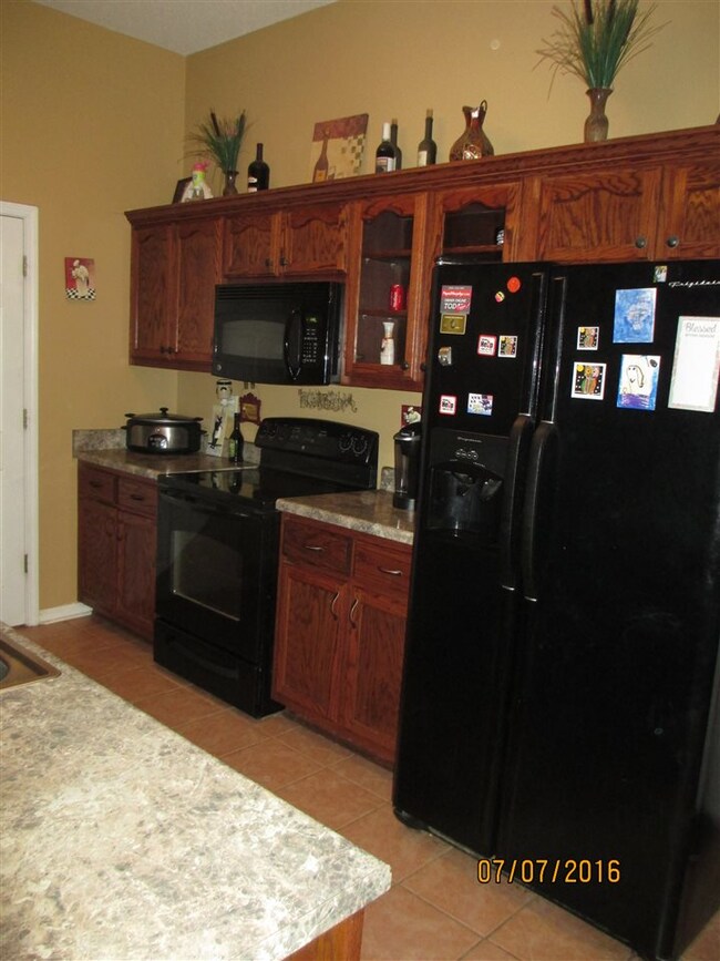 Very nice cabinets, galley style kitchen layout