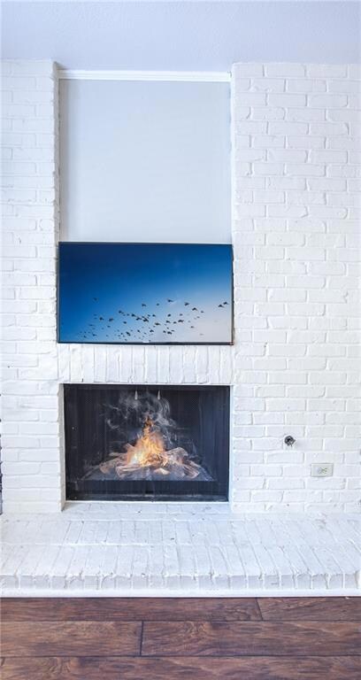 Interior details featuring a brick fireplace, cro