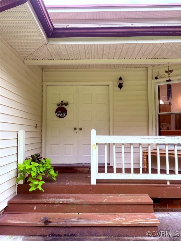 Property entrance featuring covered porch