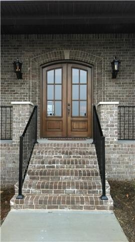 BEAUTIFUL CUSTOM DOORS AND GAS LANTERNS TO WELCOME YOUR GUESTS!