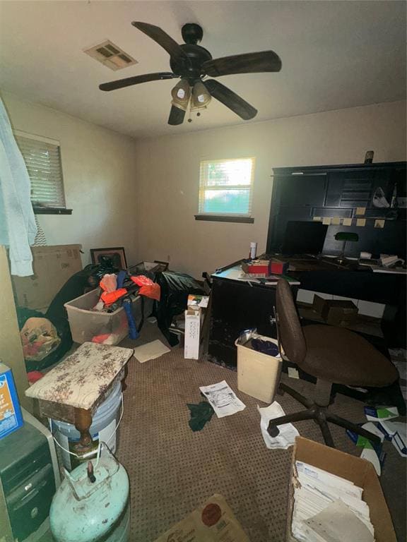 Office space with ceiling fan and carpet floors