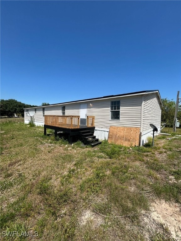 Rear view of property with a deck
