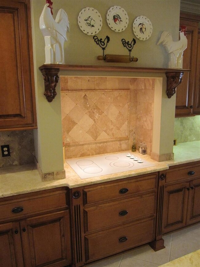 with gorgeous Travertine backsplash.