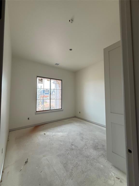 Empty room featuring concrete floors and visible v