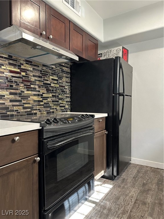 Kitchen with range, dark wood finished floors, exh
