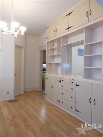 Large Wall of built in cabinet in dining room with
