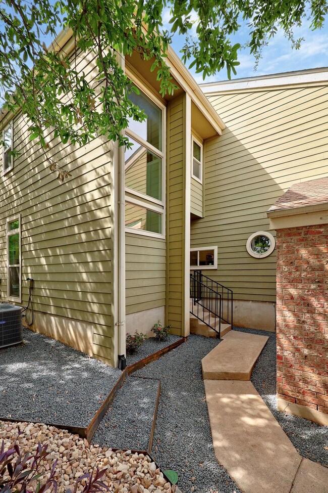 Entrance to property featuring cooling unit