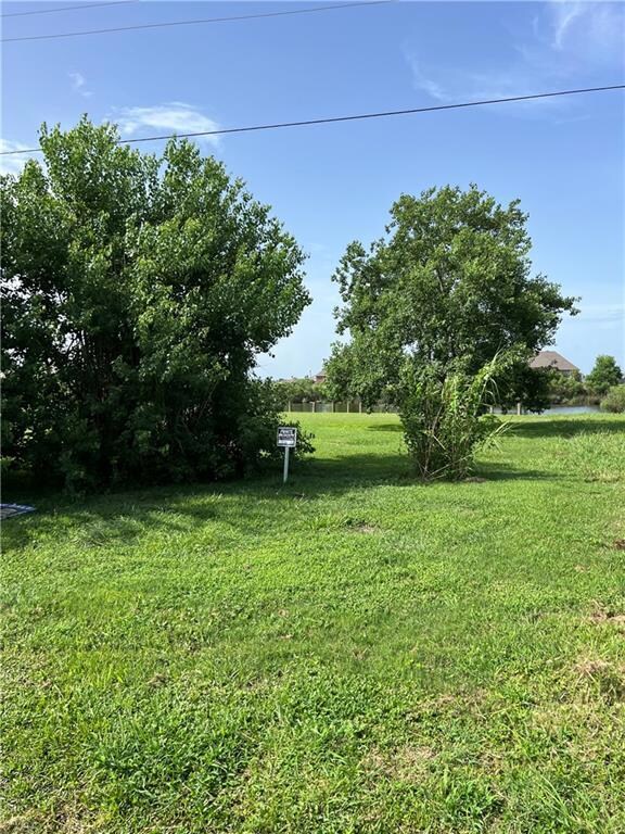 View of the front of the lot looking to the North with the canal ahead and Lake Pontchartrain behind you.