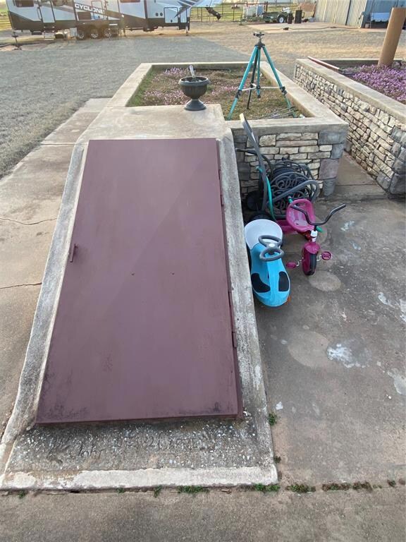 huge storm shelter with raised garden beds on top