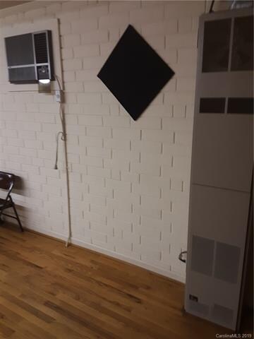 Wall mounted propane heat with window a/c.   Both 