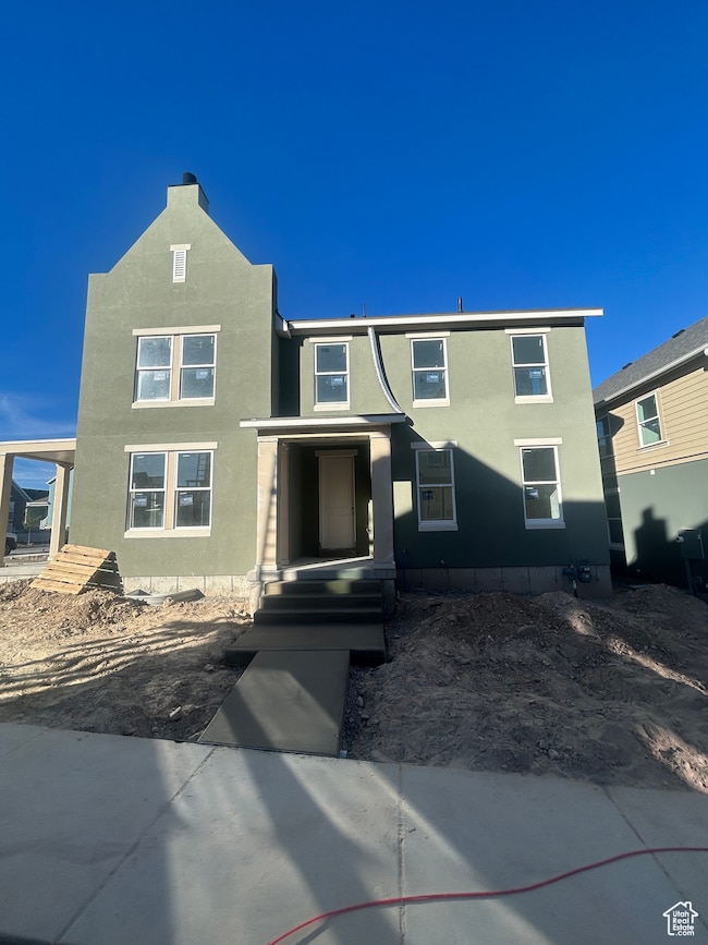 View of front facade with stucco siding