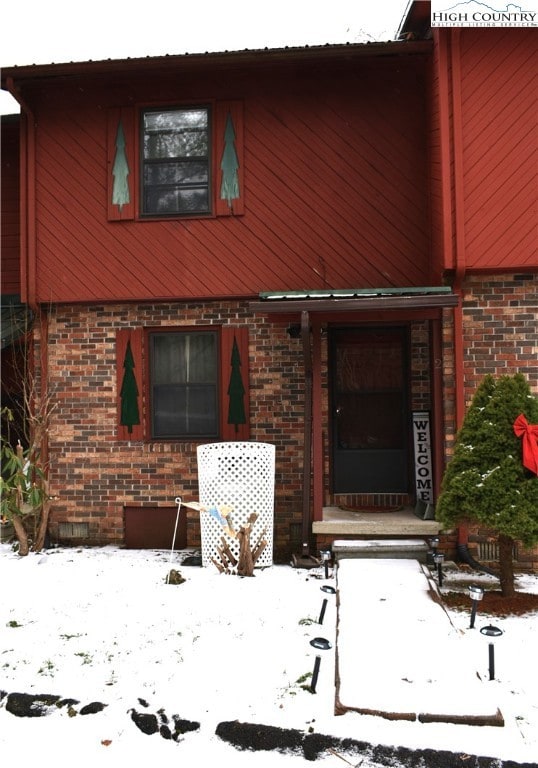 Attractive brick and wood exterior and covered fro