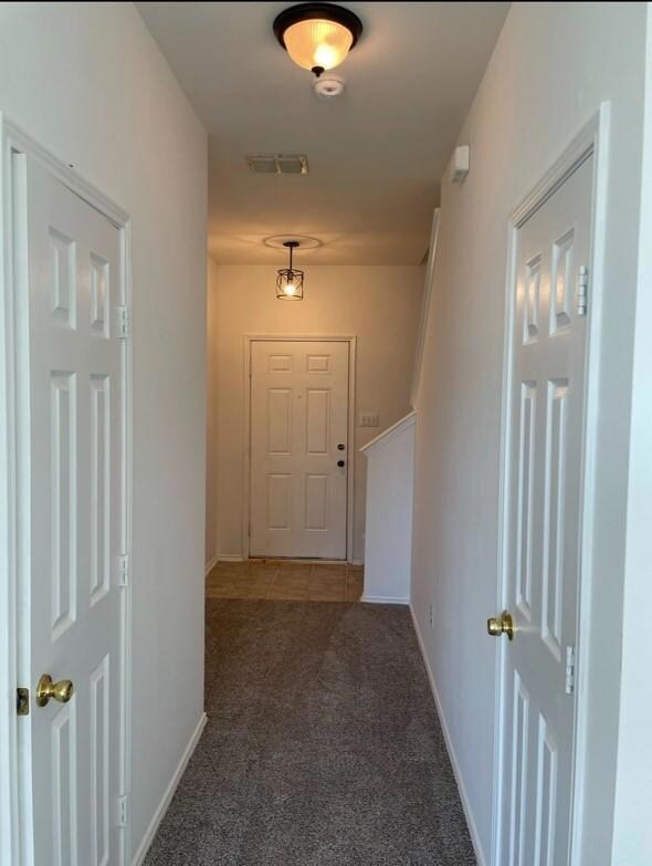 Hall with carpet flooring